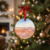 Southwestern desert keepsake hanging gracefully on a brightly lit Christmas tree branch.