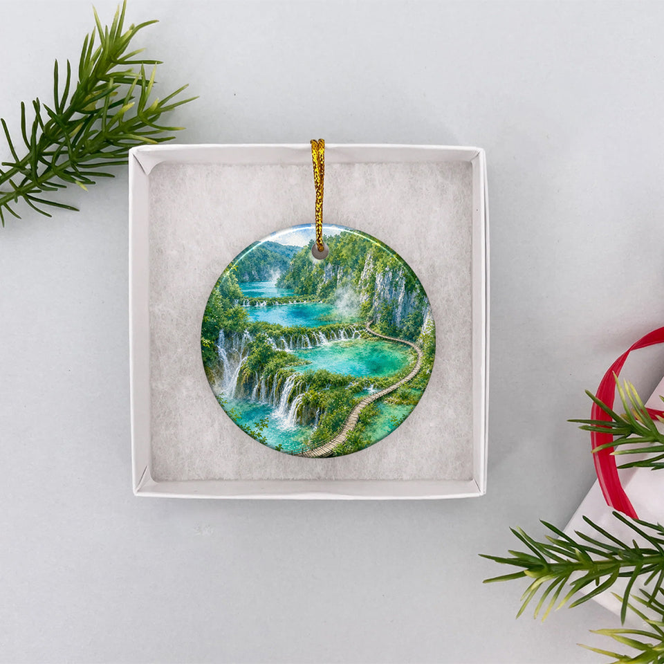 Round Plitvice keepsake ornament packaged neatly inside an open white gift box.