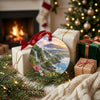 Ceramic island souvenir resting beside wrapped holiday gifts near a glowing fireplace.