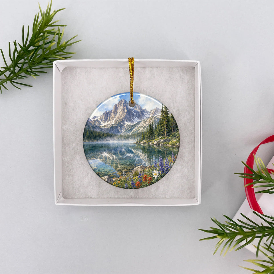 Front view of the Colorado alpine ornament tucked securely inside an open white gift box ready for gifting