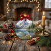 Round holiday keepsake ornament resting on a rustic table with decorative pinecones and a glowing candle
