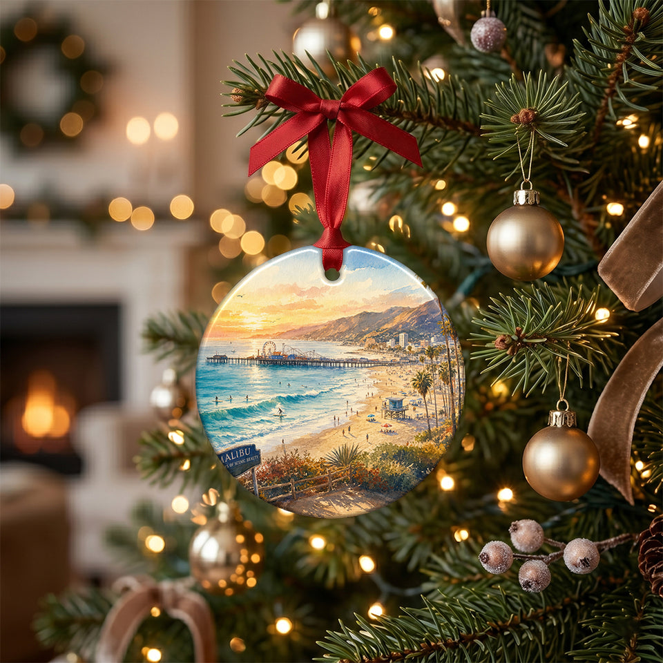 California beach souvenir ornament hanging on an illuminated Christmas tree branch.