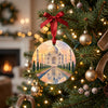 Ceramic Taj Mahal holiday keepsake hanging from a warm lit branch on a Christmas tree.