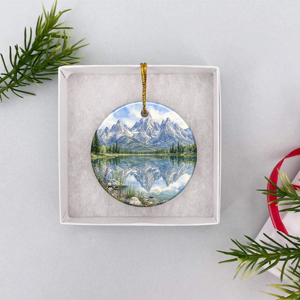 Ceramic alpine holiday keepsake presented inside an opened white gift box ready for gifting