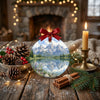 Festive mountain travel keepsake placed on a rustic table surrounded by natural pinecones and candlelight