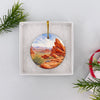 Nevada state park ornament nestled inside an open holiday gift box.