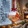 Ceramic travel ornament catching soft winter daylight in a cozy window.