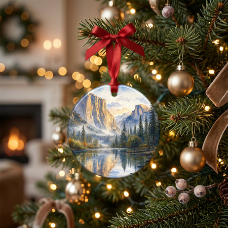 Holiday ceramic travel ornament styled on a rustic table alongside pinecones and candlelight.