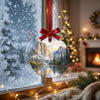 Festive California landmark ornament hanging by a frosty winter window in natural daylight.